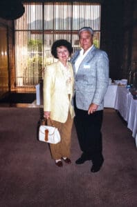 A man and woman standing next to each other.