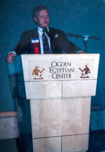 A man standing at the podium in front of an audience.