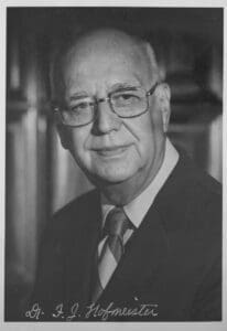 A black and white photo of an older man.