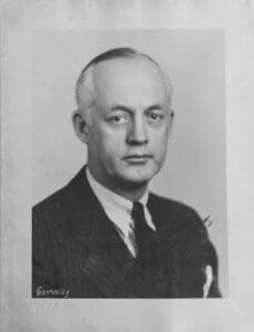 A black and white photo of an older man.